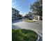 Exterior shot of a parking lot with multiple apartments buildings in the background on a sunny day at 4024 Breakview Dr # 10804, Orlando, FL 32819