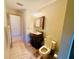Well-lit bathroom features a vanity with a decorative marble-style sink at 450 Blue Smoke Ct, Lake Mary, FL 32746