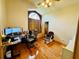 Bedroom featuring a desk, hardwood floors, and a window seat at 450 Blue Smoke Ct, Lake Mary, FL 32746