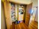 Spacious walk-in closet with ample storage shelves and wooden doors at 450 Blue Smoke Ct, Lake Mary, FL 32746