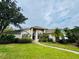 Charming single-Gathering home featuring a well-manicured lawn and lush landscaping, creating inviting curb appeal at 450 Blue Smoke Ct, Lake Mary, FL 32746