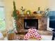 Close up on a fireplace with decorative plants at 450 Blue Smoke Ct, Lake Mary, FL 32746