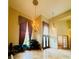 Elegant foyer with high ceilings, chandeliers, and large front doors at 450 Blue Smoke Ct, Lake Mary, FL 32746