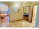 Hallway with travertine floors and views into bedrooms at 450 Blue Smoke Ct, Lake Mary, FL 32746