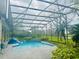 A screened-in pool with well-maintained landscaping and plenty of space for recreation at 450 Blue Smoke Ct, Lake Mary, FL 32746