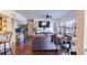 Living room featuring hardwood floors, a gray sofa, a ceiling fan, and natural light at 5005 City St # 1315, Orlando, FL 32839