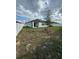 Large backyard with white fence and plenty of open space at 597 Pine Tree Blvd, Lake Alfred, FL 33850