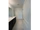Modern bathroom with a double vanity, sleek finishes, and tile flooring at 597 Pine Tree Blvd, Lake Alfred, FL 33850