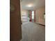 Cozy Bedroom with white crib, dresser, carpet, and decor at 597 Pine Tree Blvd, Lake Alfred, FL 33850