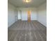 Spacious bedroom with carpet flooring, neutral walls, and closet at 597 Pine Tree Blvd, Lake Alfred, FL 33850