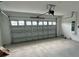 Spacious garage with open door and plenty of room at 597 Pine Tree Blvd, Lake Alfred, FL 33850