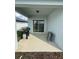 Covered patio area with BBQ perfect for outdoor entertaining at 597 Pine Tree Blvd, Lake Alfred, FL 33850