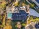 Aerial view of house with a pool and deck that is surrounded by green grass and has solar panels at 607 Golden Dawn Ln, Apopka, FL 32712