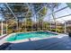 Inviting screened-in pool and spa area with ample deck space for lounging and entertaining outdoors at 607 Golden Dawn Ln, Apopka, FL 32712