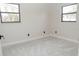 Bedroom with neutral walls, plush carpet, and good natural light from two windows at 616 Ivanhoe Way, Casselberry, FL 32707