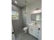 Contemporary bathroom featuring a walk-in shower and modern vanity at 6425 Curtis St, Orlando, FL 32807