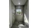 Bathroom featuring tile surround and unique floor design at 6425 Curtis St, Orlando, FL 32807