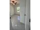 Bedroom showcasing tile flooring, a ceiling fan, natural light, and fresh paint at 6425 Curtis St, Orlando, FL 32807
