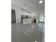 Spacious kitchen features modern cabinets, stainless steel appliances and island, perfect for culinary enthusiasts at 6425 Curtis St, Orlando, FL 32807