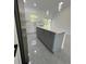 Modern kitchen island features a grey base with white countertops and ample storage at 6425 Curtis St, Orlando, FL 32807