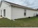 Spacious backyard with lush green grass and sliding doors at 649 Gazelle Dr, Kissimmee, FL 34759