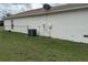 View of backyard, exterior of home and air conditioner at 649 Gazelle Dr, Kissimmee, FL 34759