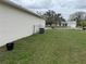 Backyard and side of house with grass at 649 Gazelle Dr, Kissimmee, FL 34759