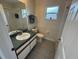 The well-lit bathroom features a shower/tub combo, toilet, and modern vanity at 649 Gazelle Dr, Kissimmee, FL 34759