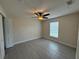 Bedroom featuring ceiling fan, tiled floor, and a view to the outside at 649 Gazelle Dr, Kissimmee, FL 34759