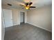This is a spacious bedroom with a ceiling fan and a closet at 649 Gazelle Dr, Kissimmee, FL 34759