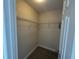 Walk-in closet with shelving in a room with neutral walls and a tile floor at 649 Gazelle Dr, Kissimmee, FL 34759