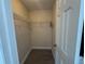 Walk-in closet with shelving in a room with neutral walls and a tile floor at 649 Gazelle Dr, Kissimmee, FL 34759