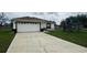 Charming single Gathering home featuring an attached two-car garage and a well-maintained lawn at 649 Gazelle Dr, Kissimmee, FL 34759