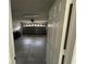 View of the garage, looking in from the doorway, with an automatic garage door at 649 Gazelle Dr, Kissimmee, FL 34759
