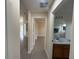 Hallway featuring updated tile flooring and access to the bathroom and bedroom at 649 Gazelle Dr, Kissimmee, FL 34759