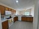 Well-lit kitchen features ample counter space, updated appliances, and a breakfast bar opening to the dining area at 649 Gazelle Dr, Kissimmee, FL 34759