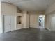 Living room featuring tile floors, an arched niche, and easy access to other rooms and closet space at 649 Gazelle Dr, Kissimmee, FL 34759