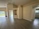Spacious living area with tile floors, an arched niche, and open access to other rooms and the backyard at 649 Gazelle Dr, Kissimmee, FL 34759
