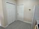 The pantry is located next to the refrigerator and features folding doors and wire shelving at 649 Gazelle Dr, Kissimmee, FL 34759