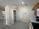 The pantry is located next to the refrigerator and features folding doors and wire shelving at 649 Gazelle Dr, Kissimmee, FL 34759