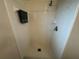 Bright tiled shower stall with shower head, shower faucet, and towel bar at 649 Gazelle Dr, Kissimmee, FL 34759