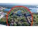 An aerial view shows the community near a lake and nature preserve at 7147 Yacht Basin Ave # 115, Orlando, FL 32835