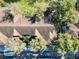 Rooftop view showcases building layout and surrounding trees, with convenient parking areas at 7147 Yacht Basin Ave # 115, Orlando, FL 32835