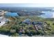 Community view highlighting lake views, landscaping, and multiple residential buildings in the area at 7147 Yacht Basin Ave # 115, Orlando, FL 32835