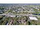 A beautiful aerial view of a neighborhood with lush green trees and a clear blue sky at 7147 Yacht Basin Ave # 115, Orlando, FL 32835