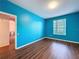 Bedroom with a view from the window and wood-look floors at 7147 Yacht Basin Ave # 115, Orlando, FL 32835