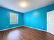 Bedroom with a window and wood-look floors at 7147 Yacht Basin Ave # 115, Orlando, FL 32835