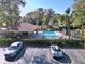 Overhead view showcases pool with shaded pavilion, lounge area, and convenient parking at 7147 Yacht Basin Ave # 115, Orlando, FL 32835