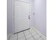 Front door offers a welcoming entrance with tile flooring and neutral-colored walls at 7147 Yacht Basin Ave # 115, Orlando, FL 32835