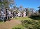 View of the exterior condo buildings with balconies and lawn at 7147 Yacht Basin Ave # 115, Orlando, FL 32835